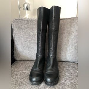 Black leather boots. 6 1/2. Stretch calves. Back zipper.